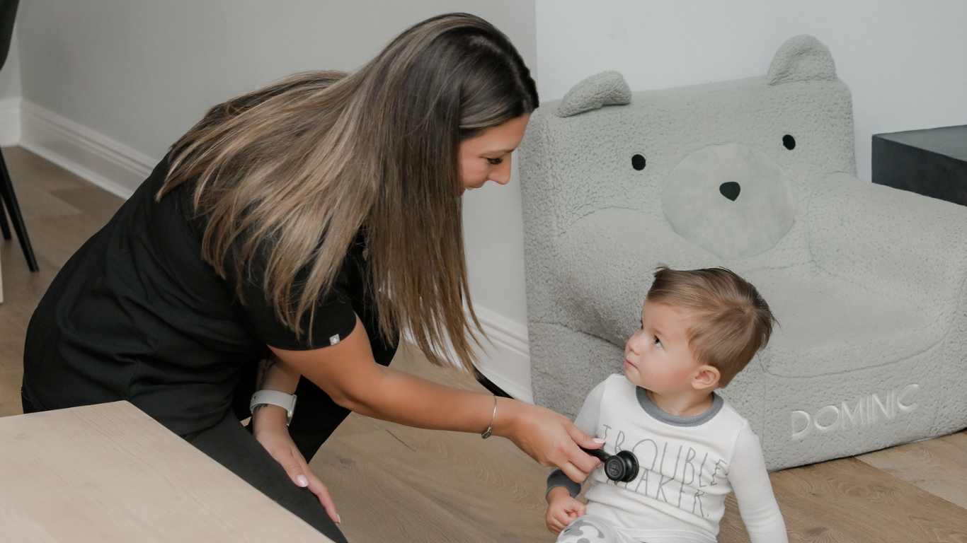 nurse listening to child's heart rate